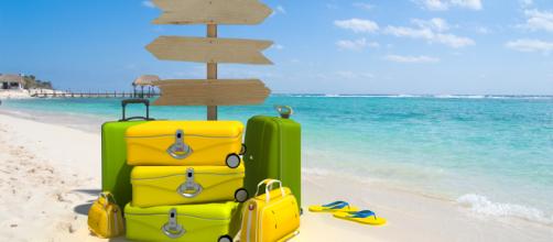 Vacanze estive al mare e valigie