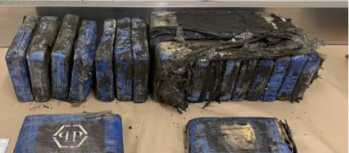 Parcels of cocaine wash up on west Auckland beach. [Image source/RNZ YouTube video]