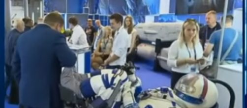 Russian Cosmonauts reveal sleek new Space Suit! Next Gen of explorers won’t be in rubber! [Image source/Vesti News YouTube video]