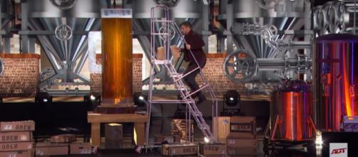 "America's Got Talent" magician Dom Chambers downs a giant beer in his semifinals performance. [Image source:AGT-YouTube]