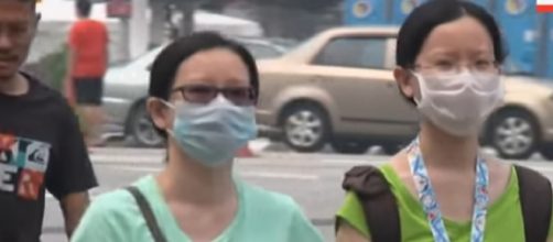 Kuala Lumpur health worries over thickening haze. [Image source/AP Archive YouTube video]