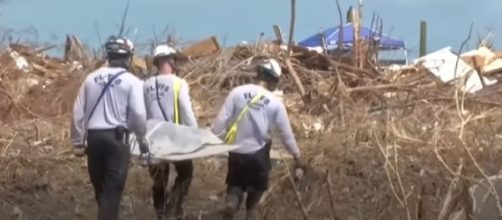 Hurricane Dorian: Search teams scour Bahamas wreckage for victims. [Image source/BBC News YouTube video]