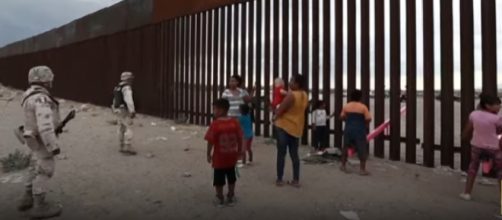 Seesaws cut through Mexico-U.S. border wall. [Image source/CGTN YouTube video]