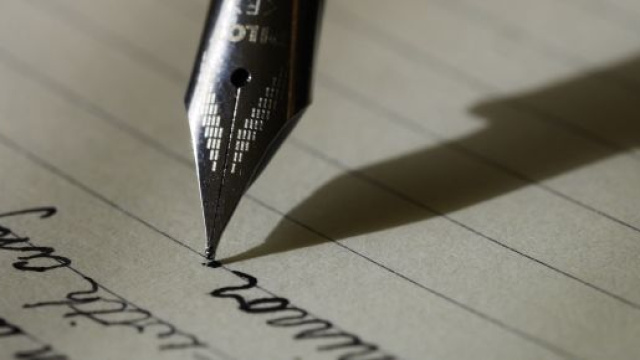 Pen writing - Photo by Aaron Burden