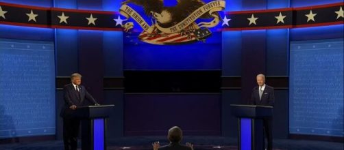 The first debate between Donald Trump and Joe Biden was moderated by Chris Wallace of Fox News [Image Source: Global News/YouTube]