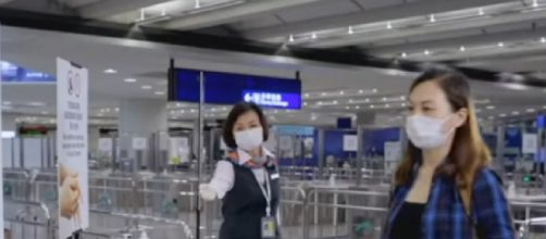 Hong Kong and Singapore 'travel bubble' is postponed amid Covid-19 spike. [Image source/South China Morning Post YouTube video]