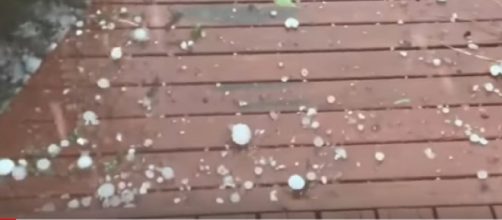 Huge hail batters Canberra as storms threaten large areas of Australia. [Image source/Guardian News YouTube video]