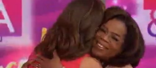 Oprah and Hoda Kotb share a genuine, real-life embrace on 'Hoda & Jenna & Friends.' [Image source:TODAY/YouTube]