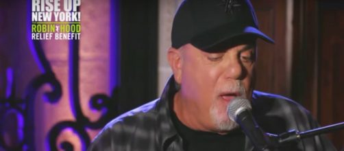 Billy Joel caps off 'Rise Up New York,' the star-studded telethon, with a song and light spectacle.[Image Source: EmpireStateBuilding/YouTube]