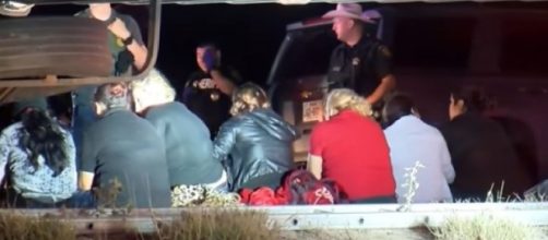 Tractor-trailer carrying more than 80 migrants stopped in South Texas. [Image source/KSAT 12 YouTube vide]