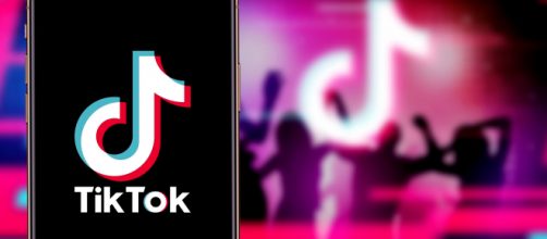 Smartphone with TIK TOK logo, which is a popular social network on the internet. [Image Source: Daniel Constante/Shutterstock]