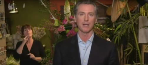 Newsom speaks on mail-in voting. [Image source: Los Angeles Times/YouTube]