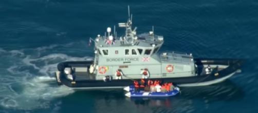 Record number of migrants cross English Channel - navy may be called in. [Image source/Channel 4 News YouTube video]