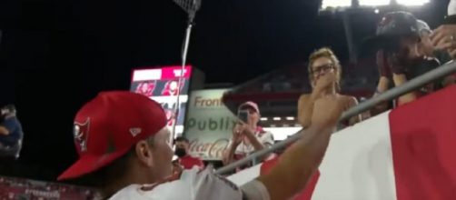 Tom Brady hands his cap to the cancer survivor (Image source: ABC Action News/YouTube)