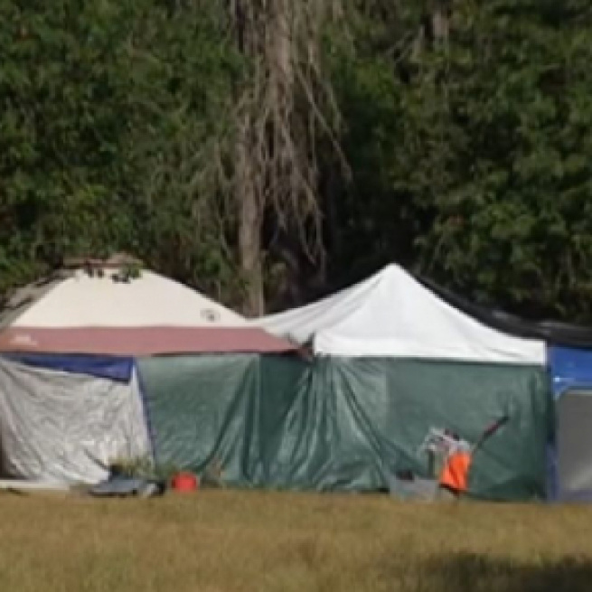 Homeless camp near Seattle's Green Lake has neighbors concerned (Image source: King 5/YouTube)