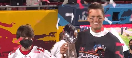 Brady celebrates his 5th MVP trophy with kids (© NFL/YouTube)