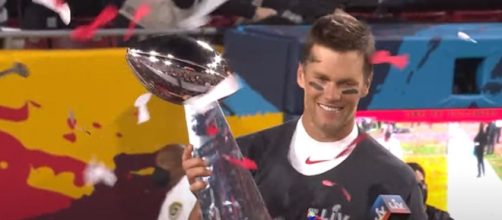 Brady holds his fifth Super Bowl MVP trophy (© NFL/YouTube)