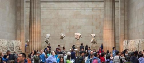 Visitors stand in front of Parthenon sculptures at London's British Museum (Image source: British Museum)