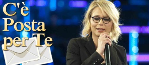 Il logo di C'è posta per te e Maria De Filippi © Mediaset