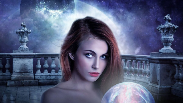 Un'avvenente maga all'interno di un mondo fantasy © Pixabay.