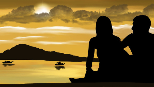 Coppia seduta sulla riva al tramonto – © Pixabay IA.