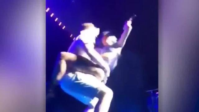 Lady Gaga falls off stage with a fan during Las Vegas show